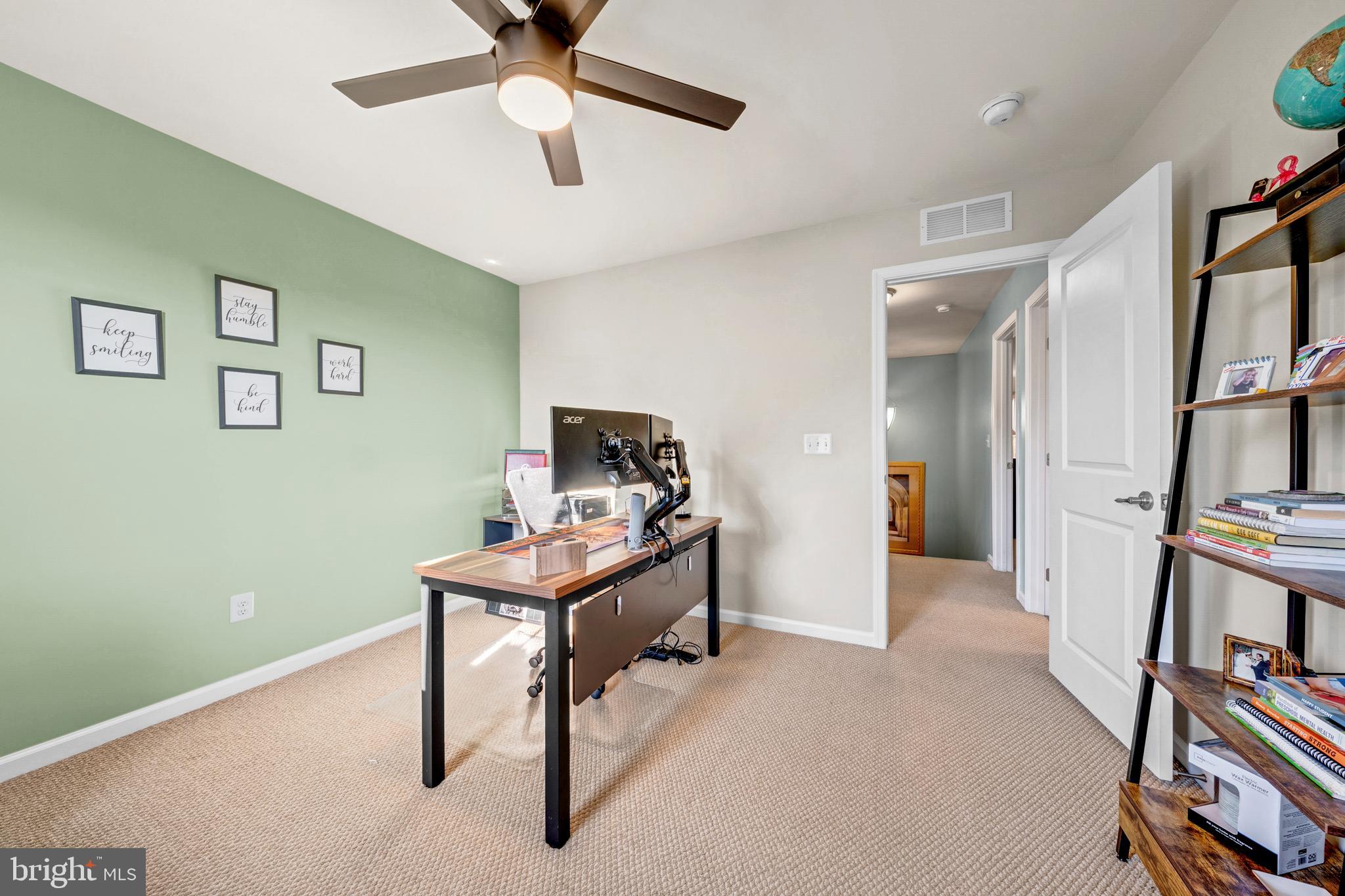 7137 Shepherdstown Road Warrenton, VA 20187 - Photo 36 of 60 a view of a workspace with furniture and a window
