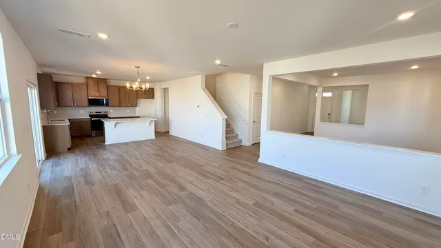 a view of an empty room and a window