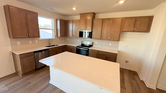 a bathroom with a double vanity sink and mirror with shower