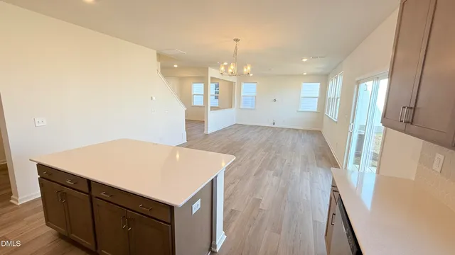 a kitchen with stainless steel appliances a sink and a stove