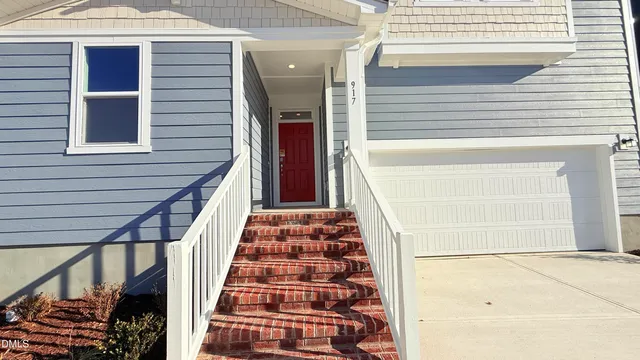 a view of living room with furniture and a rug
