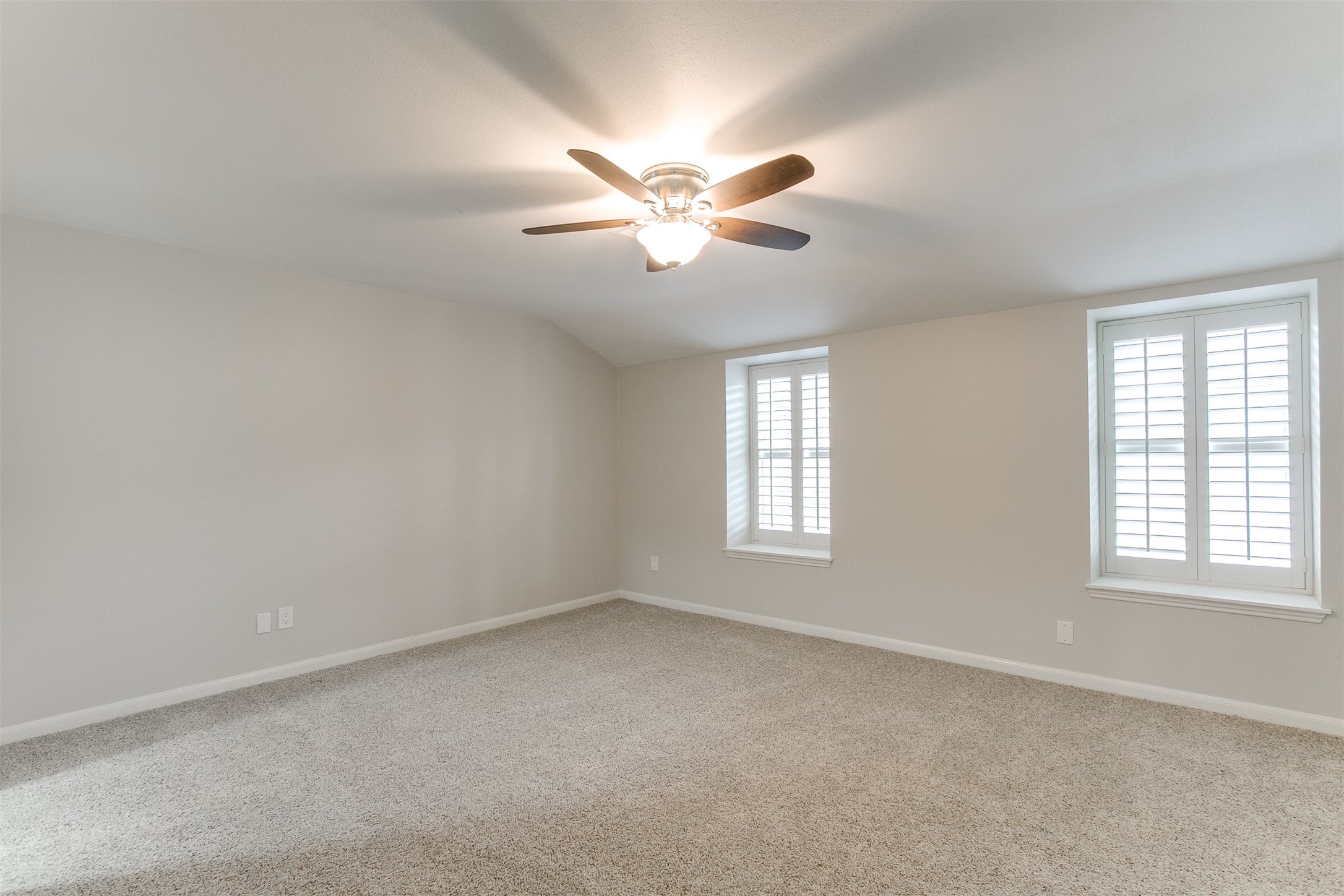 1407 Springrock Lane Houston, TX 77055 - Photo 10 of 25 The Master Bedroom is spacious and features double paned windows dressed in plantation shutters that allow for an abundance of natural lighting.