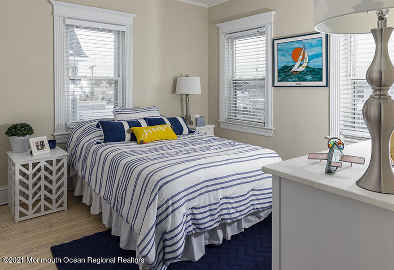 204 4th Avenue Bradley Beach, NJ 07720 - Photo 12 of 24 a bedroom with a bed and a painting on the wall