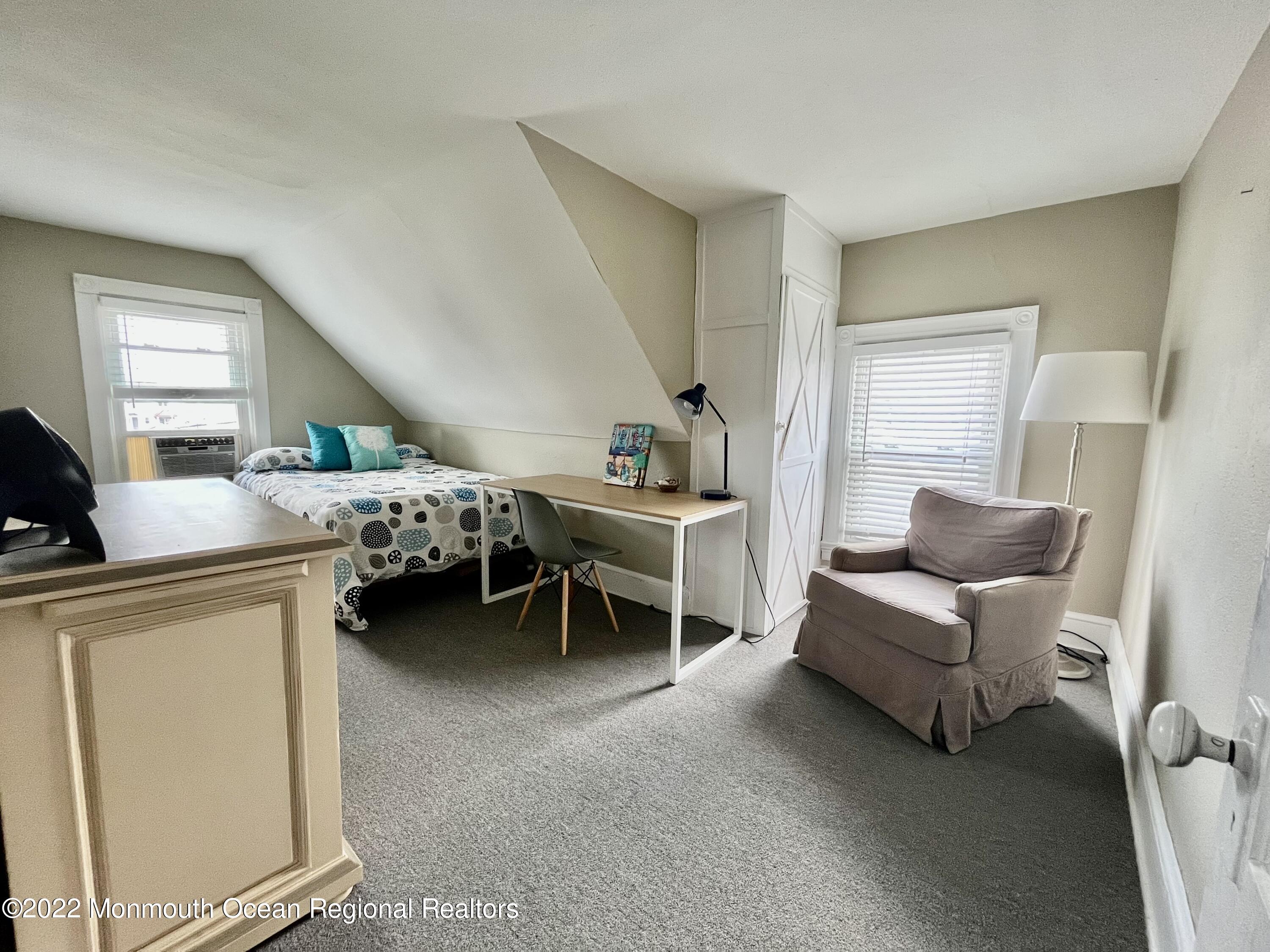 204 4th Avenue Bradley Beach, NJ 07720 - Photo 17 of 24 a living room with furniture and a window