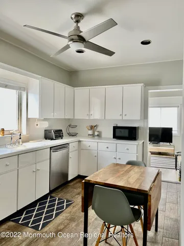 a kitchen with a sink cabinets and window