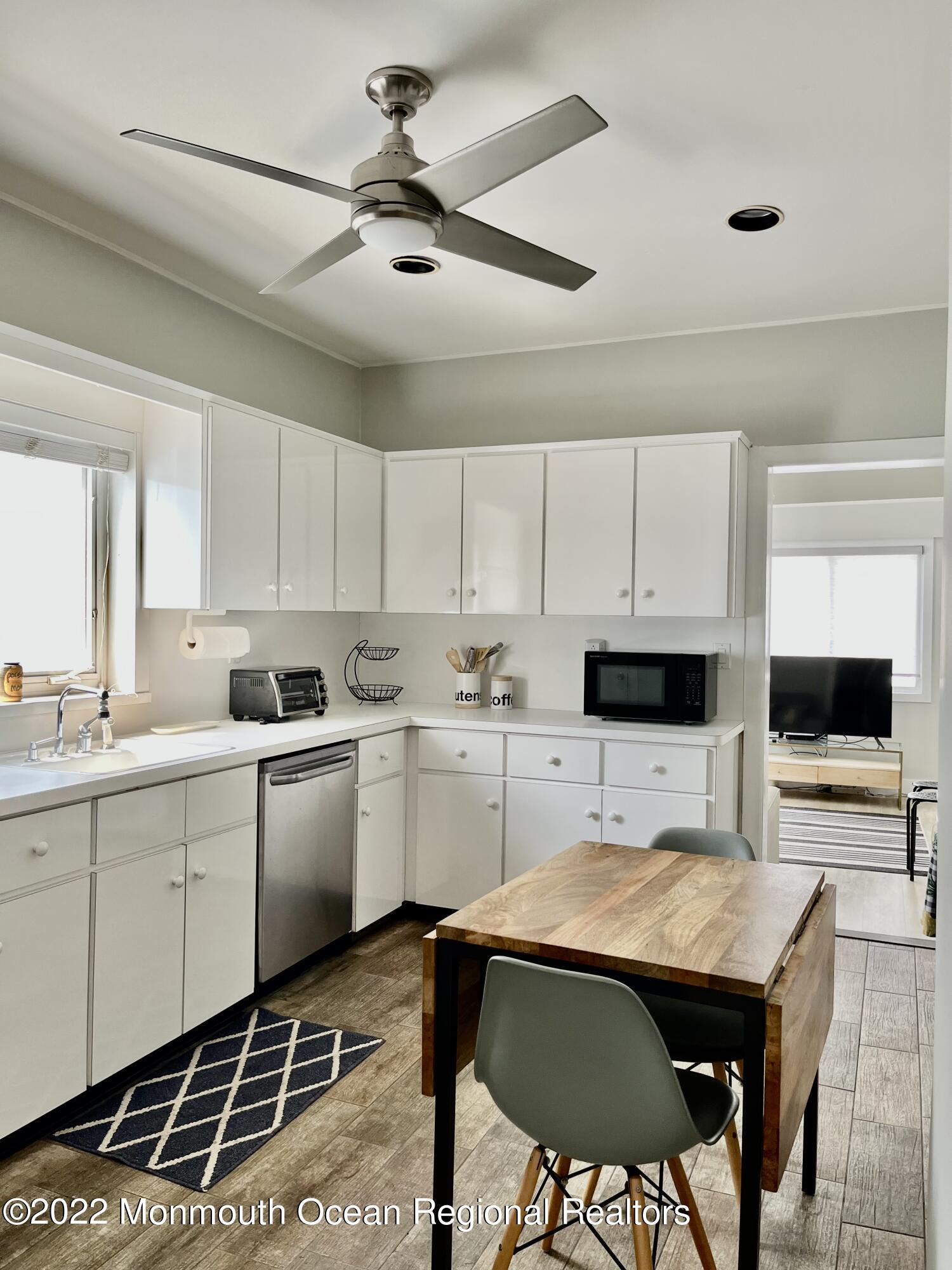 204 4th Avenue Bradley Beach, NJ 07720 - Photo 7 of 24 a kitchen with a sink cabinets and window