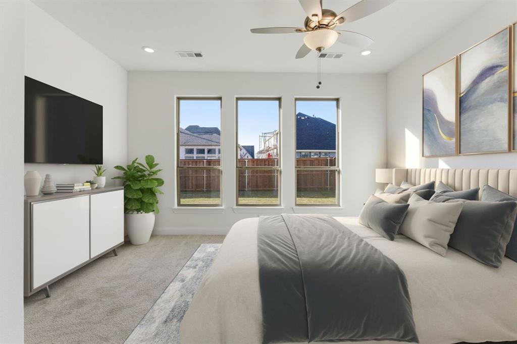 241 Bay Laurel Road McKinney, TX 75071 - Photo 20 of 32 a bedroom with a large bed and a flat screen tv