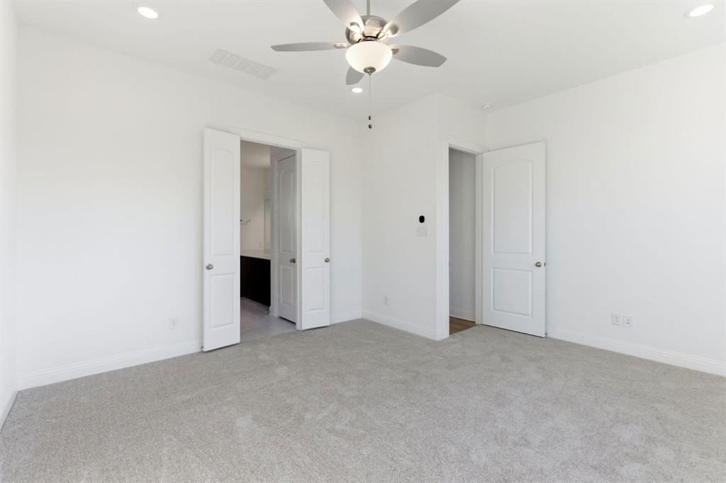 241 Bay Laurel Road McKinney, TX 75071 - Photo 24 of 32 an empty room with a ceiling fan and a window