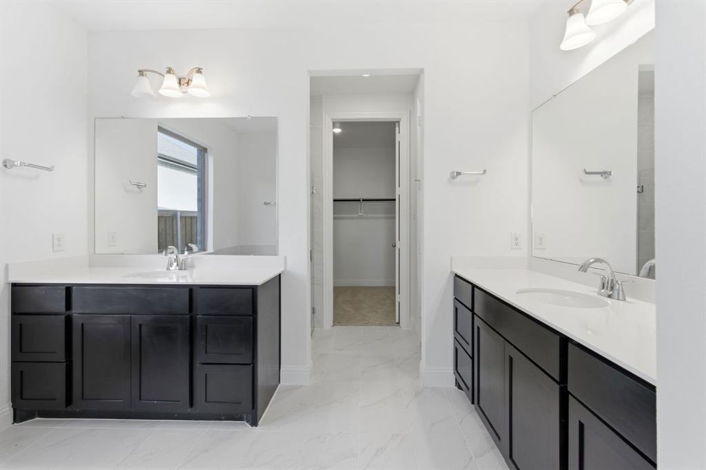 241 Bay Laurel Road McKinney, TX 75071 - Photo 28 of 32 a bathroom with a sink and a mirror