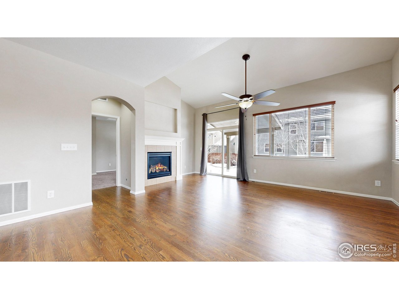5543 Calgary Street Timnath, CO 80547 - Photo 4 of 48 Living Room with access to back yard
