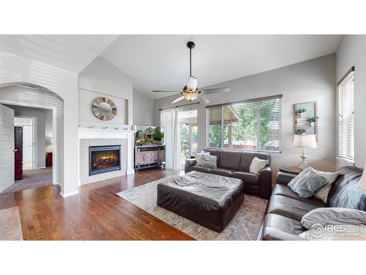 5543 Calgary Street Timnath, CO 80547 - Photo 5 of 48 Cozy Living Room (Photo Taken in 2022)