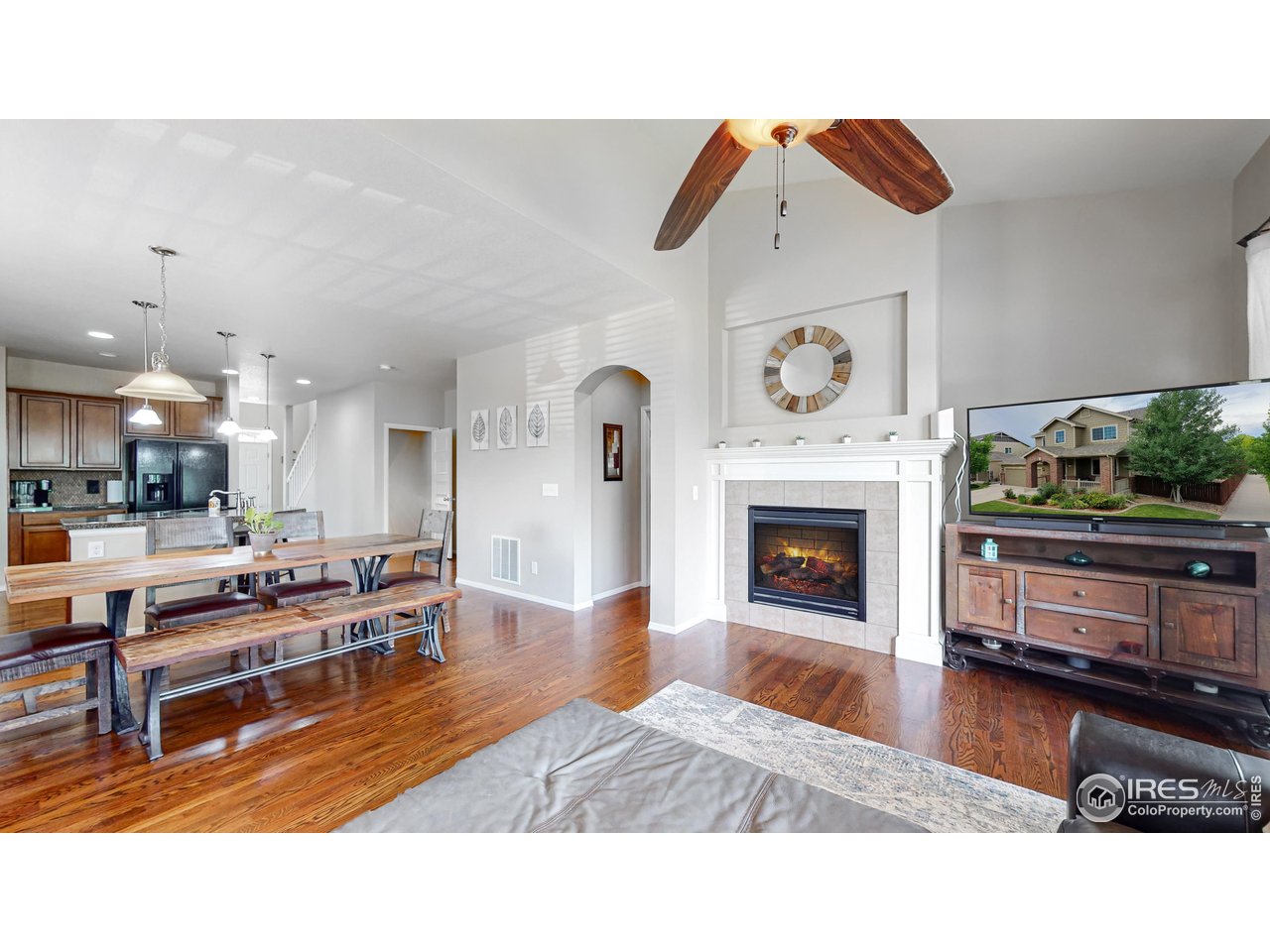 5543 Calgary Street Timnath, CO 80547 - Photo 9 of 48 Living Dining Rooms with cozy fireplace (Photo Taken in 2022)