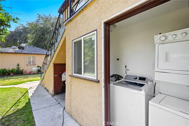 a view of a storage & utility room with washer and dryer