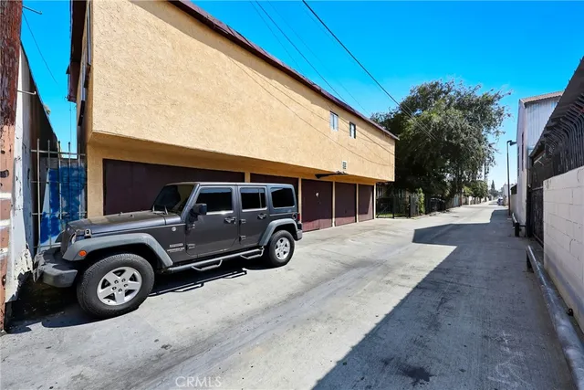 a view of a car parked in front of a house