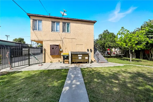 a view of a house with a back yard