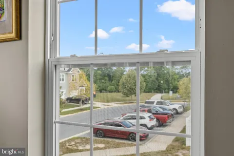 a room with furniture and a large window