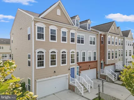 a front view of a house with large windows