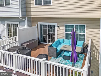 a view of two chairs in the balcony