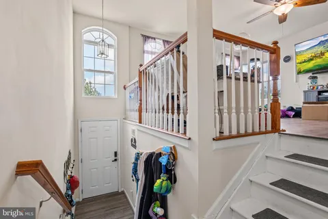 a view of an entryway with wooden floor