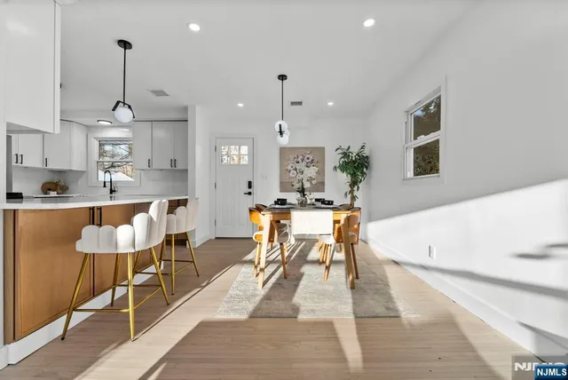 a kitchen with a sink stove and wooden cabinets