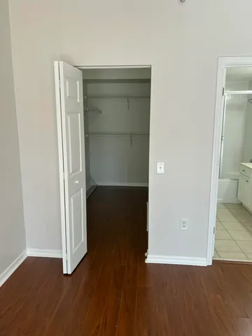 a view of a room with wooden floor