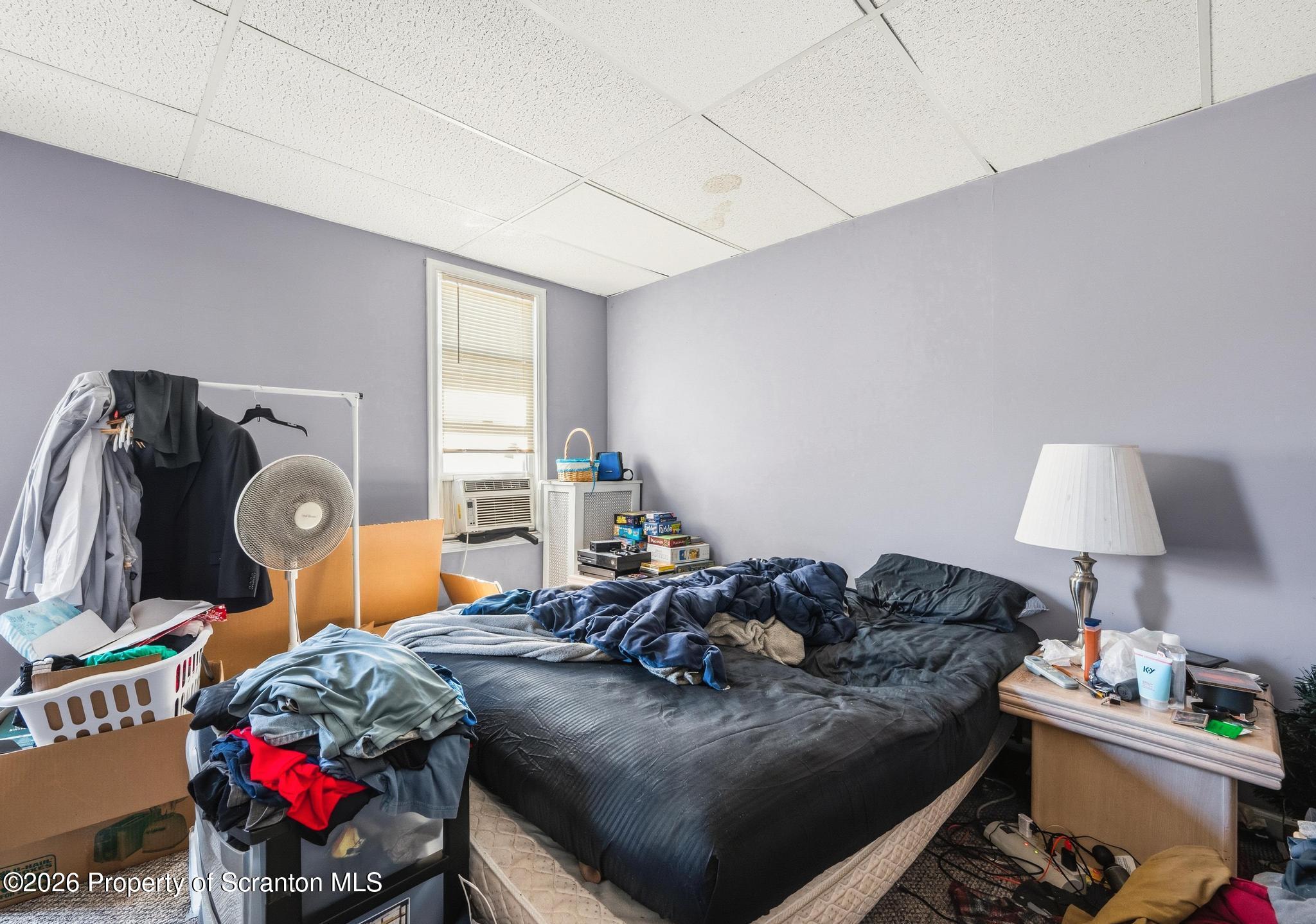 518 Prospect Avenue Scranton, PA 18505 - Photo 37 of 59 a living room with furniture a bed and a lamp