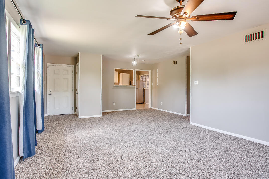 2802 54th Street Lubbock, TX 79413 - Photo 3 of 14 an empty room with closet and a chandelier fan