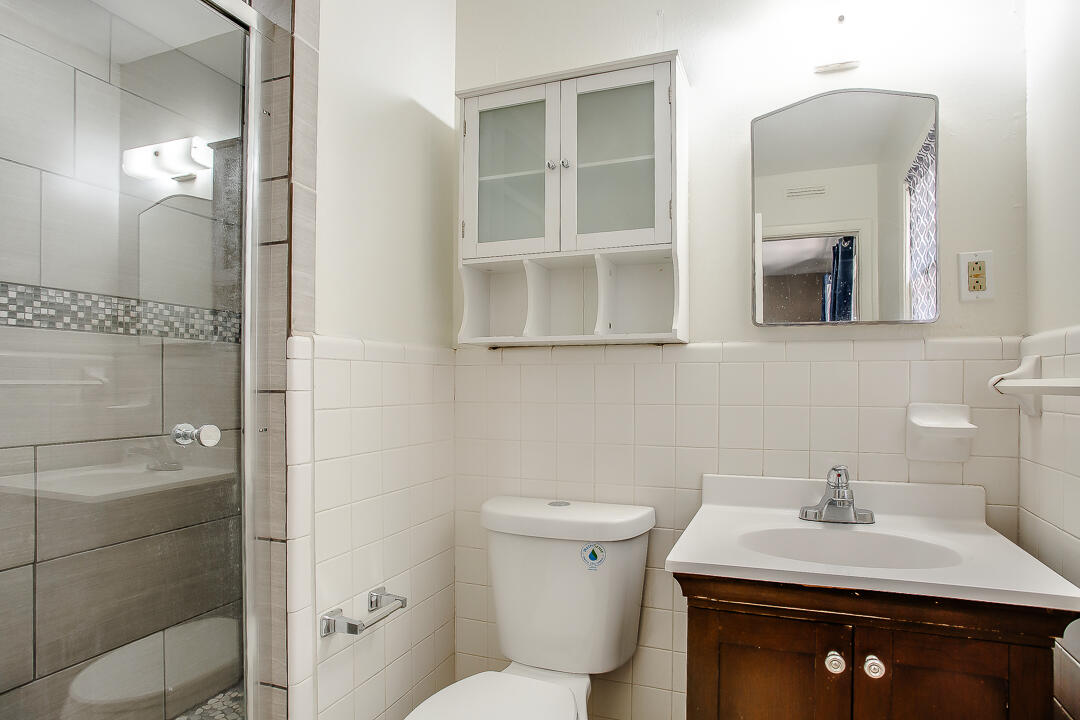 2802 54th Street Lubbock, TX 79413 - Photo 8 of 14 a bathroom with a sink toilet and shower