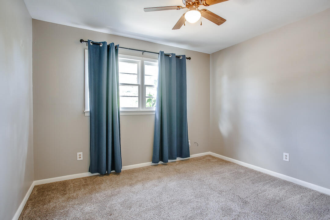 2802 54th Street Lubbock, TX 79413 - Photo 10 of 14 a view of an empty room and a window