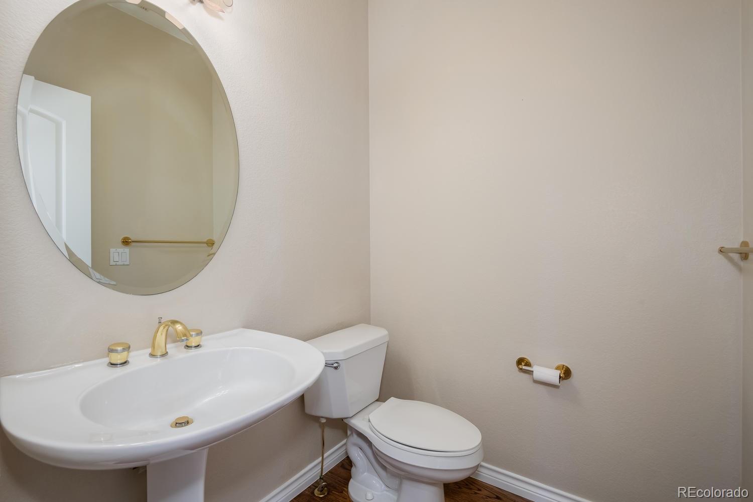 210 Cook Street Denver, CO 80206 - Photo 13 of 26 a bathroom with a sink and a mirror