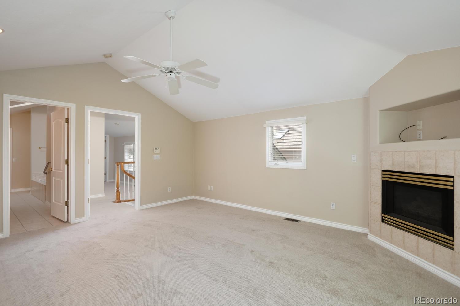 210 Cook Street Denver, CO 80206 - Photo 15 of 26 an empty room with windows and fireplace