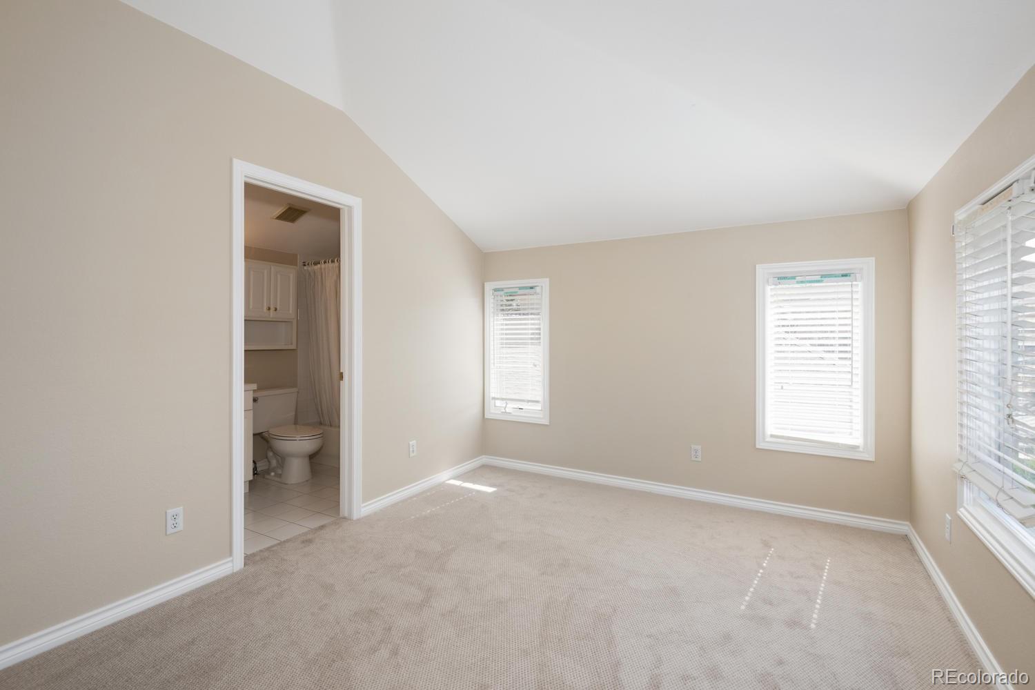 210 Cook Street Denver, CO 80206 - Photo 19 of 26 an empty room with windows and closet