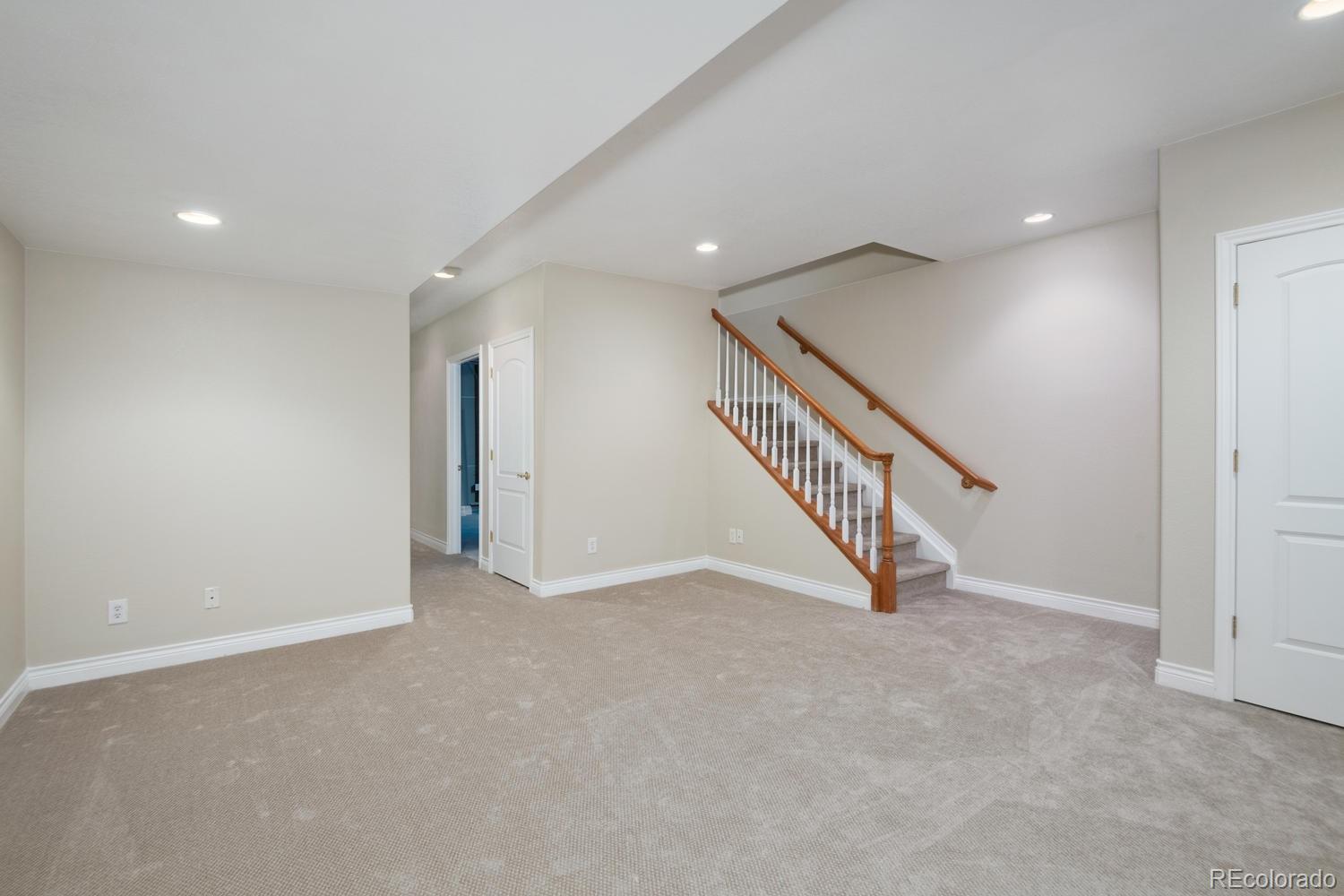 210 Cook Street Denver, CO 80206 - Photo 22 of 26 a view of an empty room with stairs