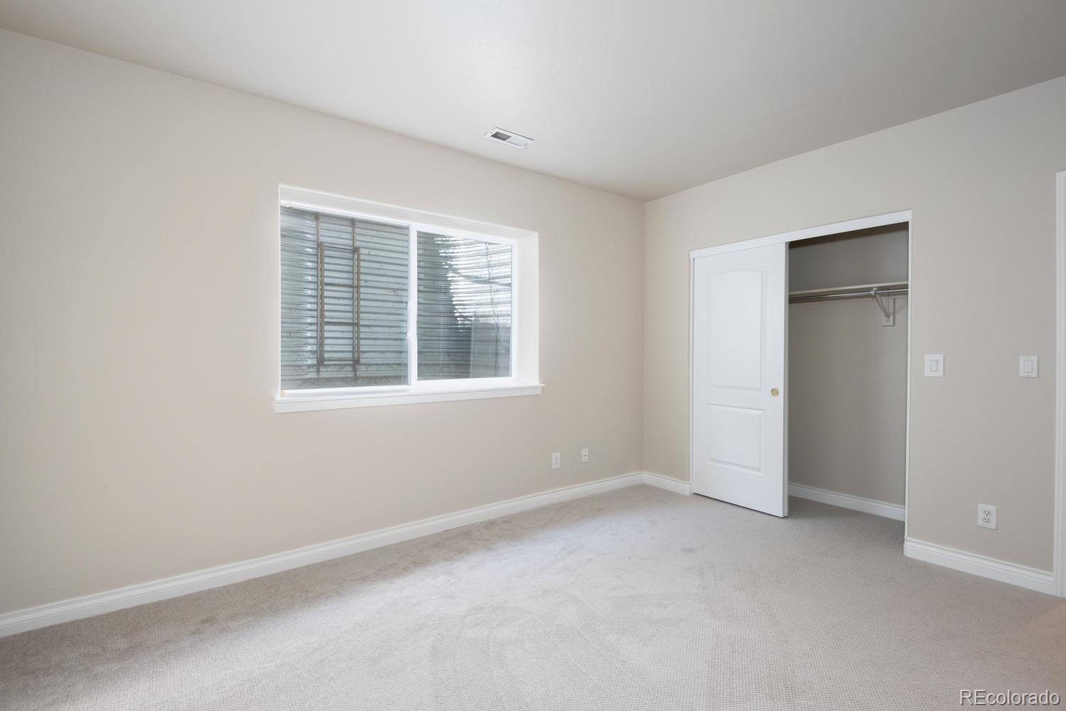 210 Cook Street Denver, CO 80206 - Photo 24 of 26 an empty room with windows