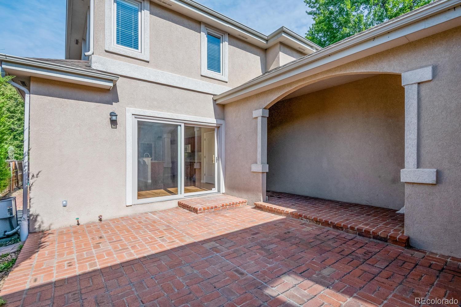 210 Cook Street Denver, CO 80206 - Photo 25 of 26 a view of a house with a backyard