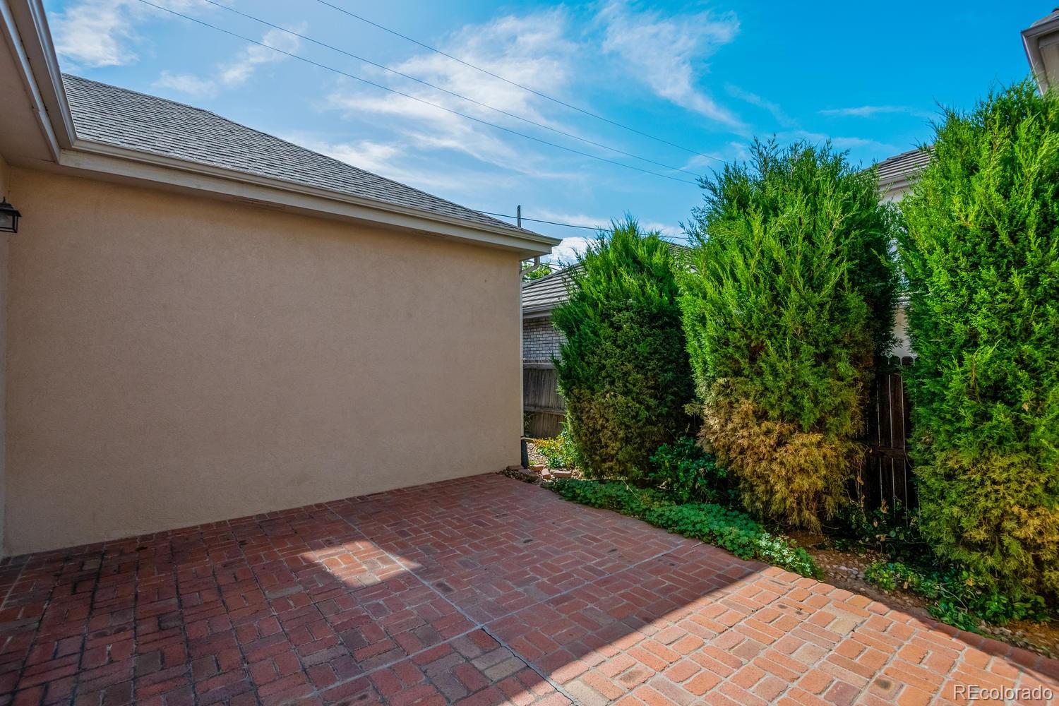 210 Cook Street Denver, CO 80206 - Photo 26 of 26 a backyard of a house with lots of green space