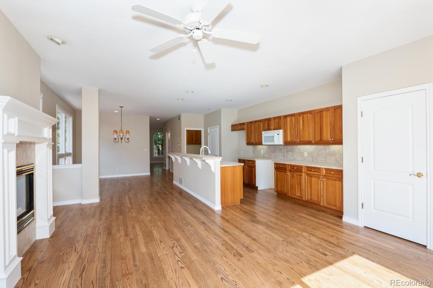 210 Cook Street Denver, CO 80206 - Photo 8 of 26 a large kitchen with lot of wooden floor