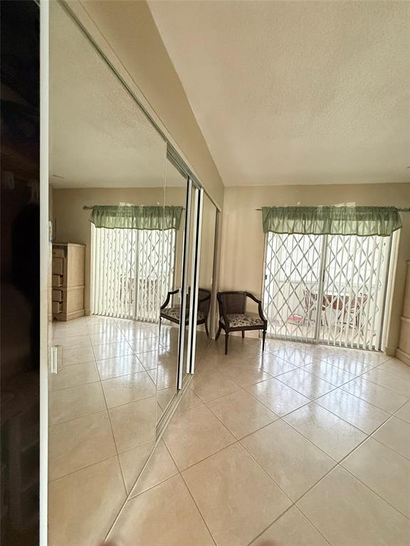 53 Markham C, Unit 53 Deerfield Beach, FL 33442 - Photo 12 of 30 a view of an empty room with a window