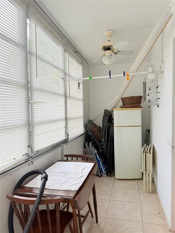 53 Markham C, Unit 53 Deerfield Beach, FL 33442 - Photo 18 of 30 a dinning table and chairs in a room