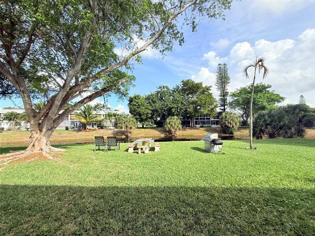53 Markham C, Unit 53 Deerfield Beach, FL 33442 - Photo 19 of 30 a view of a park with large trees