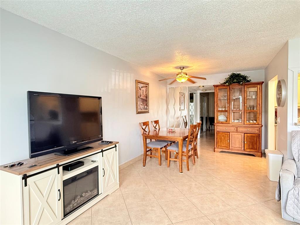 53 Markham C, Unit 53 Deerfield Beach, FL 33442 - Photo 2 of 30 a view of a livingroom with furniture and a flat screen tv