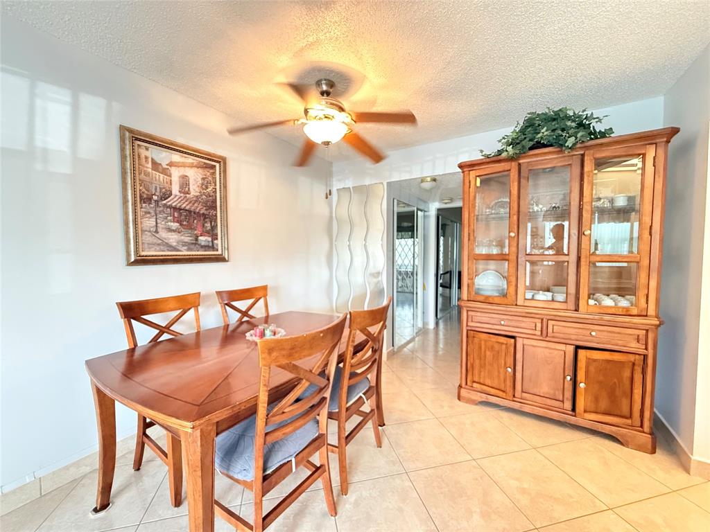 53 Markham C, Unit 53 Deerfield Beach, FL 33442 - Photo 3 of 30 a dining room with large window