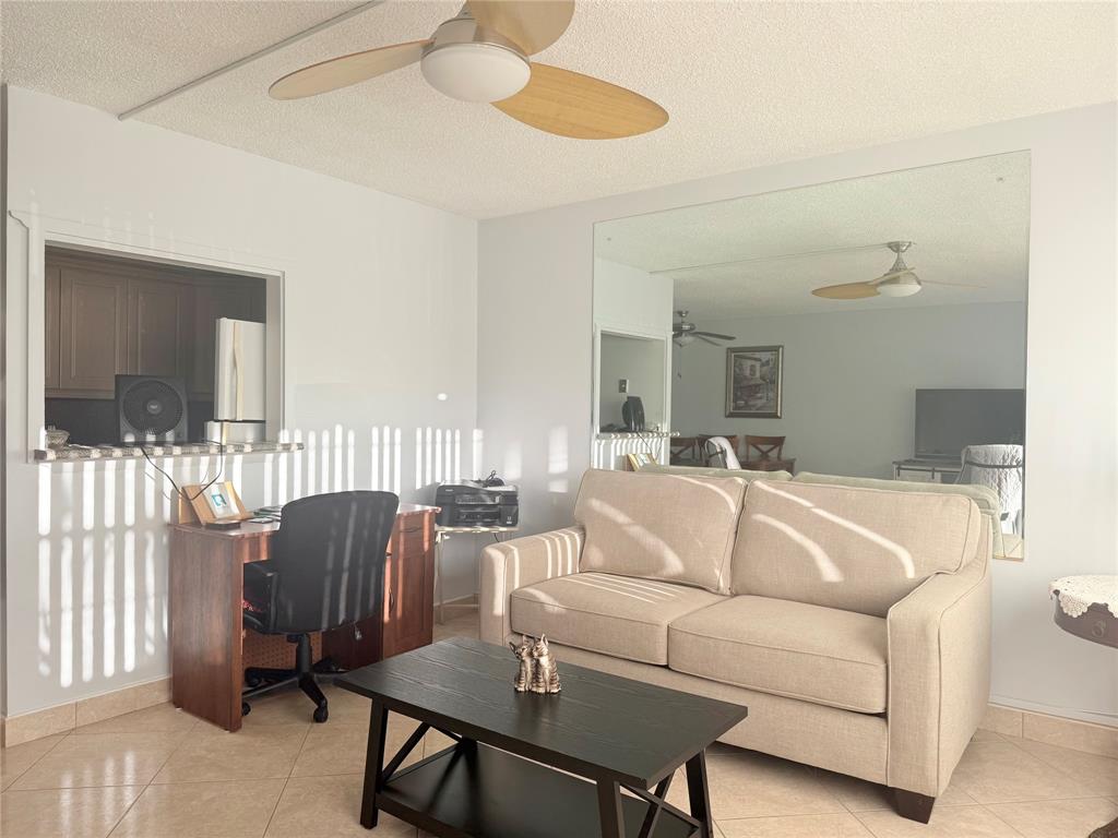 53 Markham C, Unit 53 Deerfield Beach, FL 33442 - Photo 7 of 30 a living room with furniture and a wooden floor