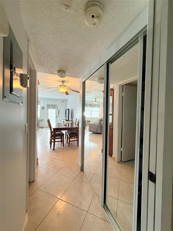 53 Markham C, Unit 53 Deerfield Beach, FL 33442 - Photo 9 of 30 a view of kitchen with furniture and floor to ceiling window