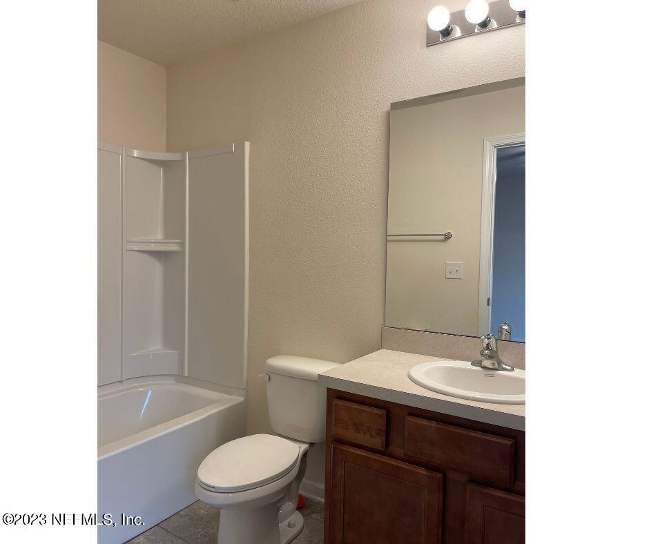 343 Servia Drive St. Johns, FL 32259 - Photo 8 of 8 a bathroom with a sink a toilet and shower