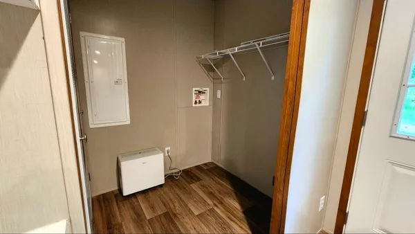 a view of bathroom with a sink and a mirror