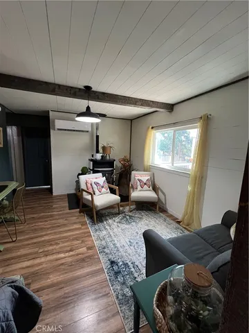 a bedroom with furniture and a window