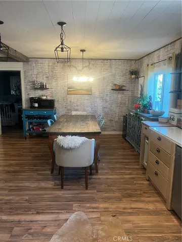 a room with counter space and breakfast area