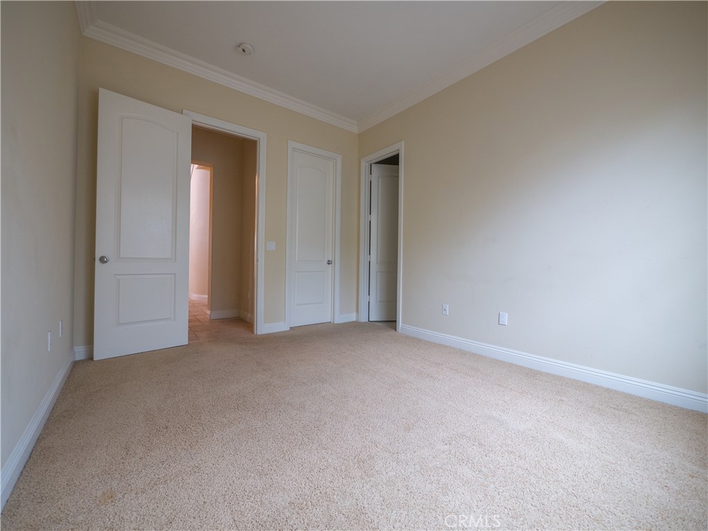 8111 Sunset Rose Drive Corona, CA 92883 - Photo 11 of 19 a view of an empty room and closet area