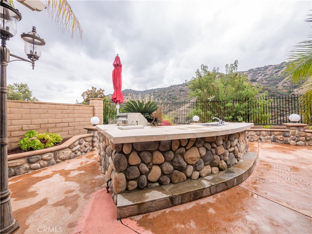 8111 Sunset Rose Drive Corona, CA 92883 - Photo 13 of 19 a view of a chairs and tables in the patio